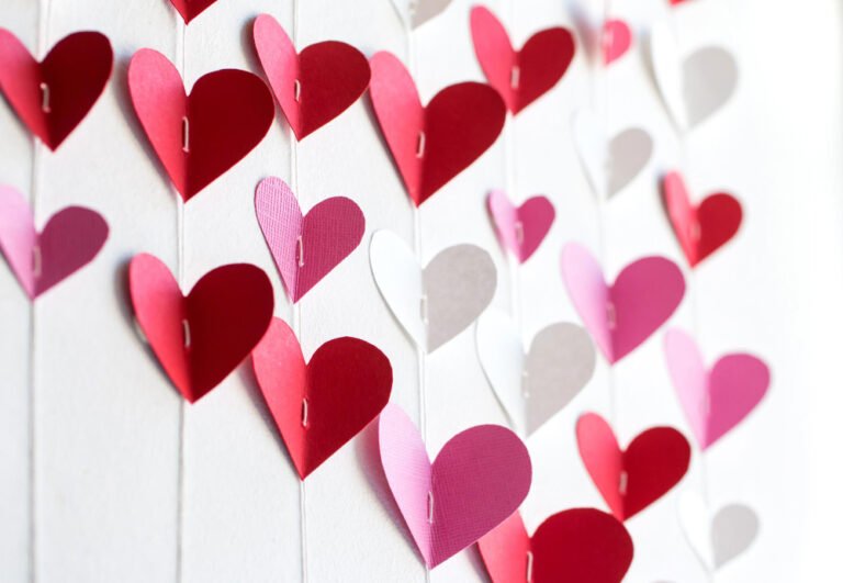 Valentine’s Day Decor Ideas pink-red-ornament-made-heartspaper-hearts-red-white-pink-colors-strung-threads-hang-white-wall