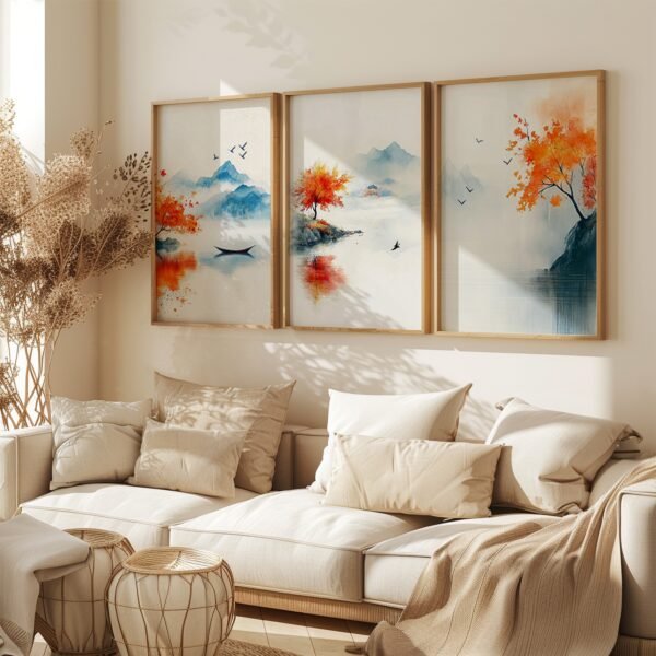 Living room with beige sofa, cushions, and textured throws. Above, three framed landscape paintings depict mountains and trees in vibrant reds and blues.