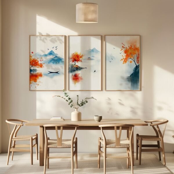 Serene dining room with wooden table and chairs, featuring three framed nature paintings of autumn trees and mountains in warm hues.