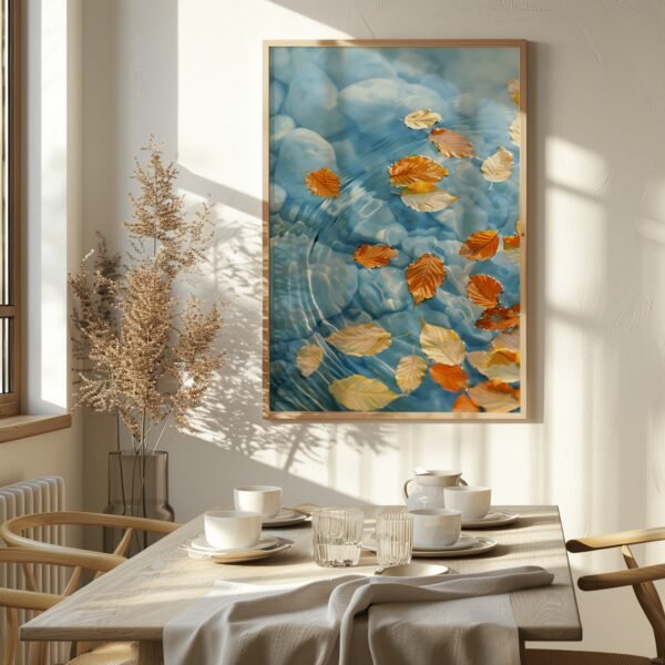 Serene dining area with framed Japandi Wall Art Autumn of floating leaves on water, illuminated by warm sunlight and soft shadows.