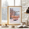 A pink tram artwork resting on a desk by the window, with snow falling outside and warm fairy lights adding a cozy ambiance.