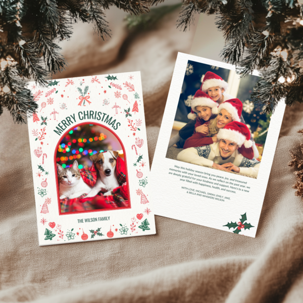 Customizable Christmas Cards showcase the front and second pages on a tablecloth with snow-dusted pine branches for a seasonal touch.