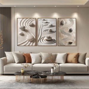 A living room in beige, brown, and terracotta tones. Above the sofa, three Zen Garden Prints in light frames enhance the Japandi aesthetic. The earthy hues and natural elements create a calming and harmonious atmosphere.