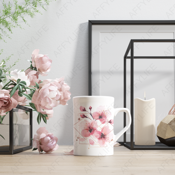 White mug with pink floral designs and gold accents, surrounded by peonies and geometric decor. Abstract flowers clipart in use.