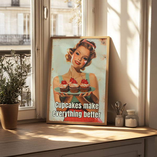 A 1950s Poster of a smiling woman holding a plate of cupcakes rests on a sunlit windowsill. The text reads, "Cupcakes make everything better," enhancing the cheerful, nostalgic feel