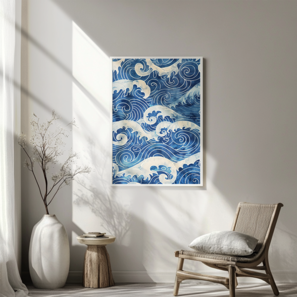 A cozy room with a beige wall displays a framed Blue Japandi Wave Wall Art of deep blue ocean waves. Sunlight highlights a tall vase with branches, rustic stool, and cushioned chair, creating a calm, earthy atmosphere.