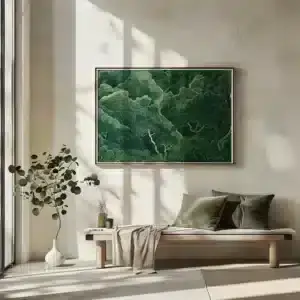 A minimalist room with a large Sage Green Horizontal Wall Art, a wooden bench with green cushions and beige throw below, and a white vase with a plant.