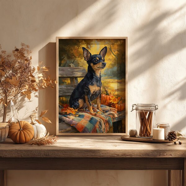 Framed artwork of a Chihuahua on an autumnal bench, surrounded by pumpkins and leaves, displayed on a rustic table with candles and dried foliage.
