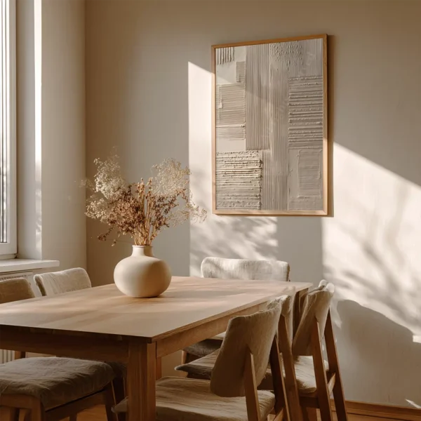 Dining area with wooden table, cushioned chairs, and a vase of dried flowers. Japandi Abstract Wall Art on the wall adds soft texture to the calm, minimalist space.