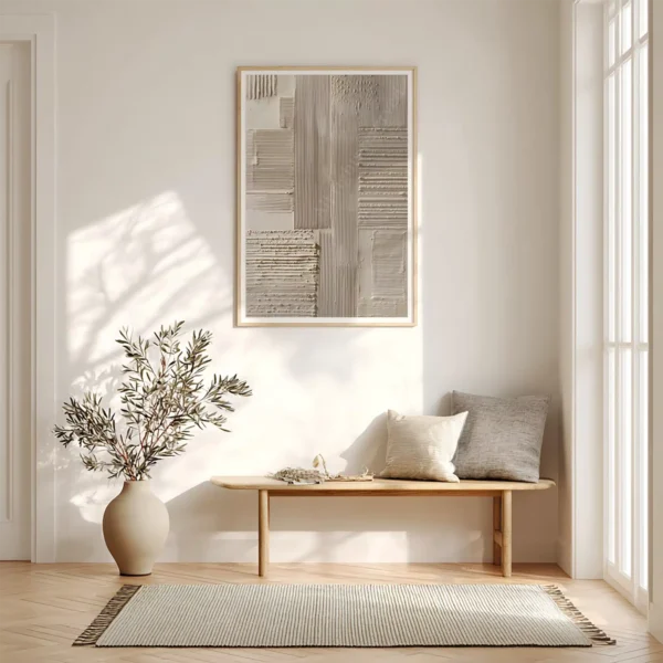 Wooden bench with grey cushions beneath a framed Japandi Abstract Wall Art. A vase of branches and soft sunlight complete the tranquil scene.