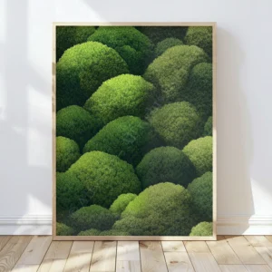 Framed Japanese Green Wall Art depicting swirling green treetops. Sunlight enhances the vivid tones and serene mood.