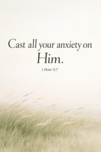 Serene landscape with swaying grass and open sky featuring the Bible verse “Cast all your anxiety on Him – 1 Peter 5:7”