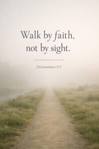 Foggy morning path stretching into the distance with grassy fields and the Bible verse “Walk by faith, not by sight – 2 Corinthians 5:7” overlay.